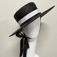 black side wide brimmed hat with white head band by zarbella